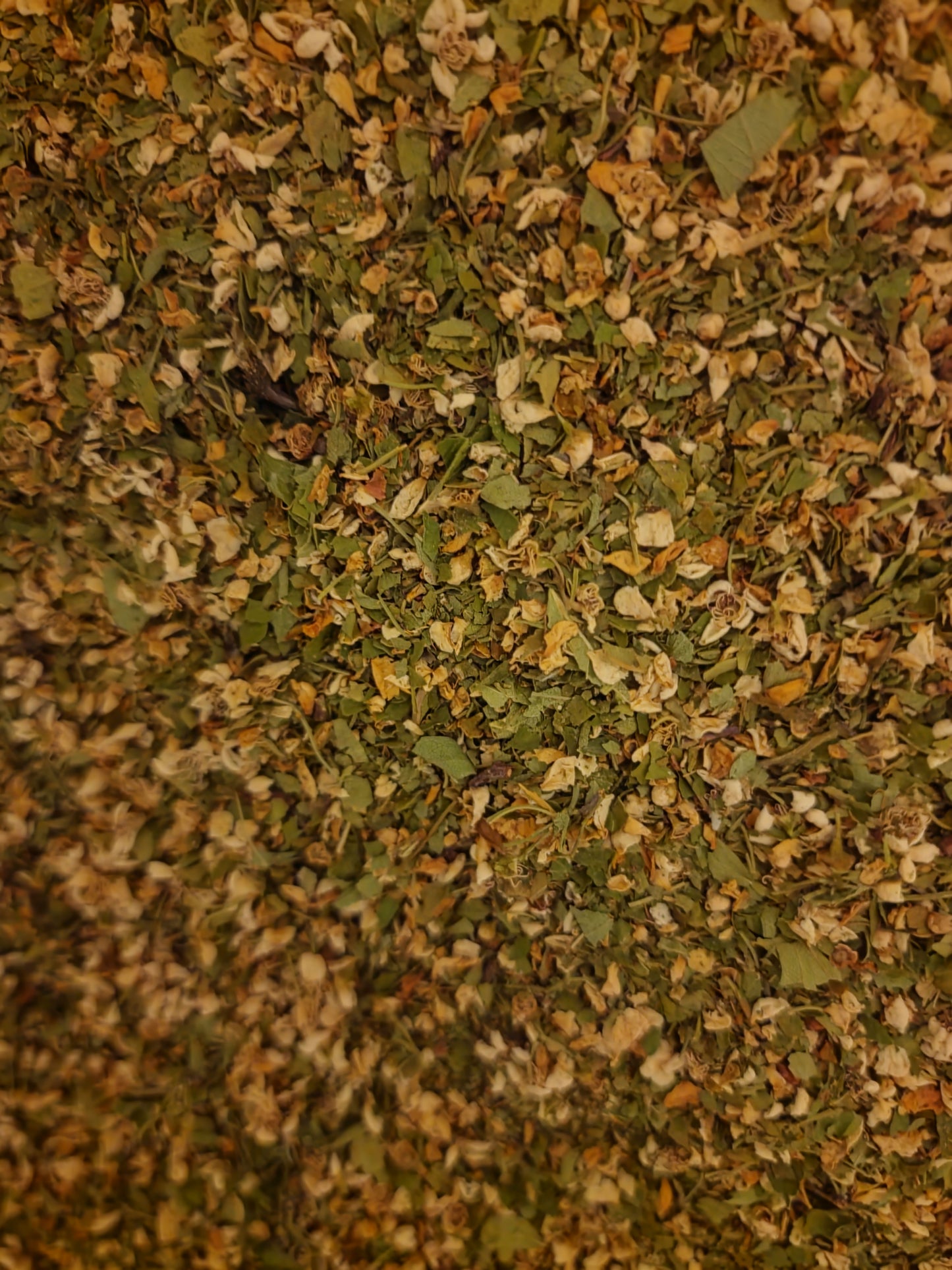 close up of dried hawthorn leaf and flower, part of Cardiotonic blend full spectrum hawthorn berry, leaf and flower