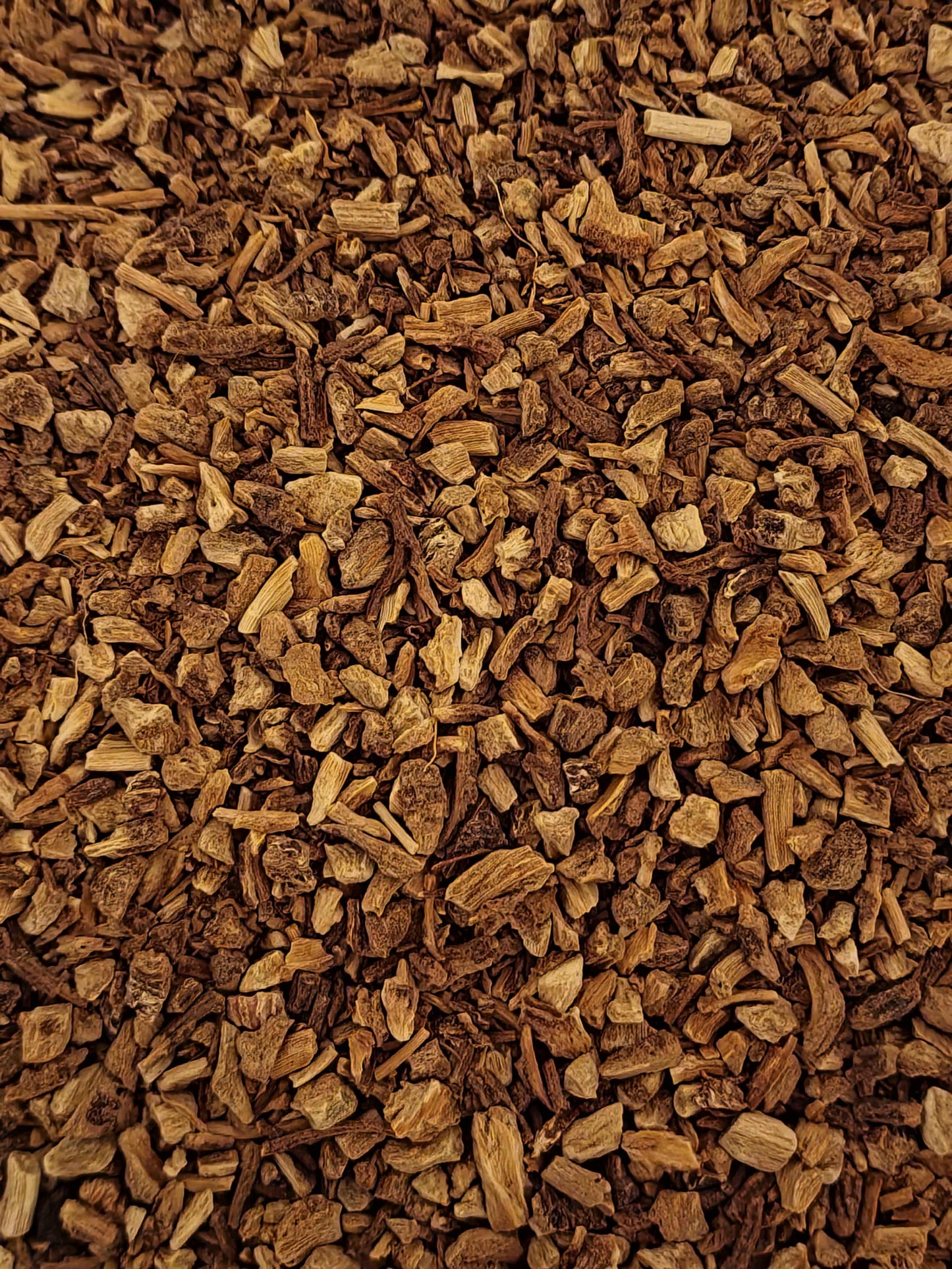 Close-up of dried and cut Organic Angelica root, an herbal remedy from Botanical Remedies herbal dispensary, loose herbal tea