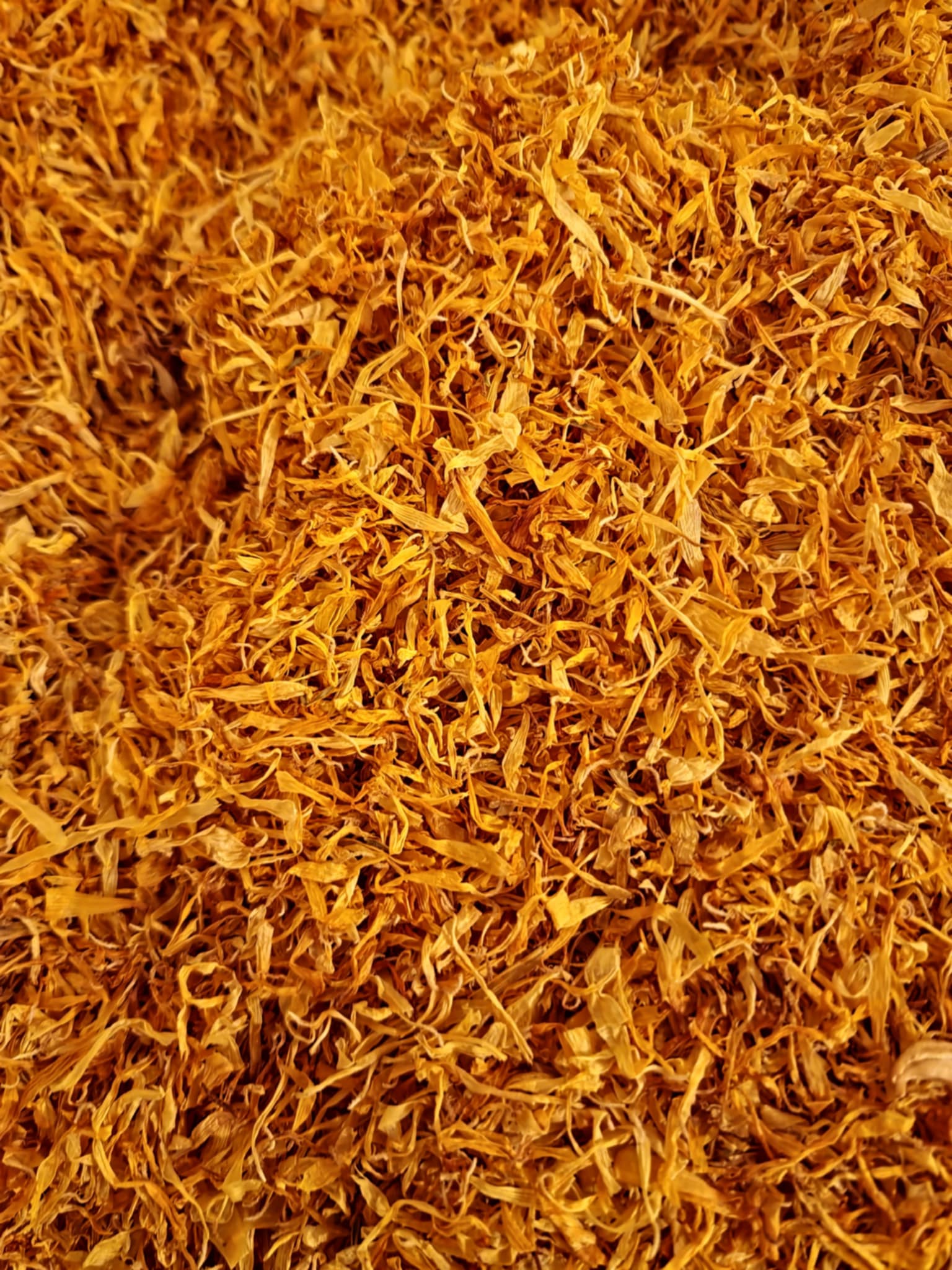 Close-up of dried and cut Organic marigold flower petals