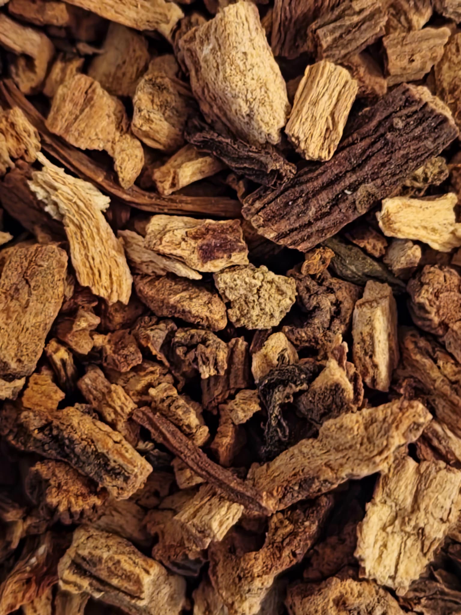 Close-up of dried and cut Organic Gentian root pieces from Botanical Remedies Herbal Dispensary