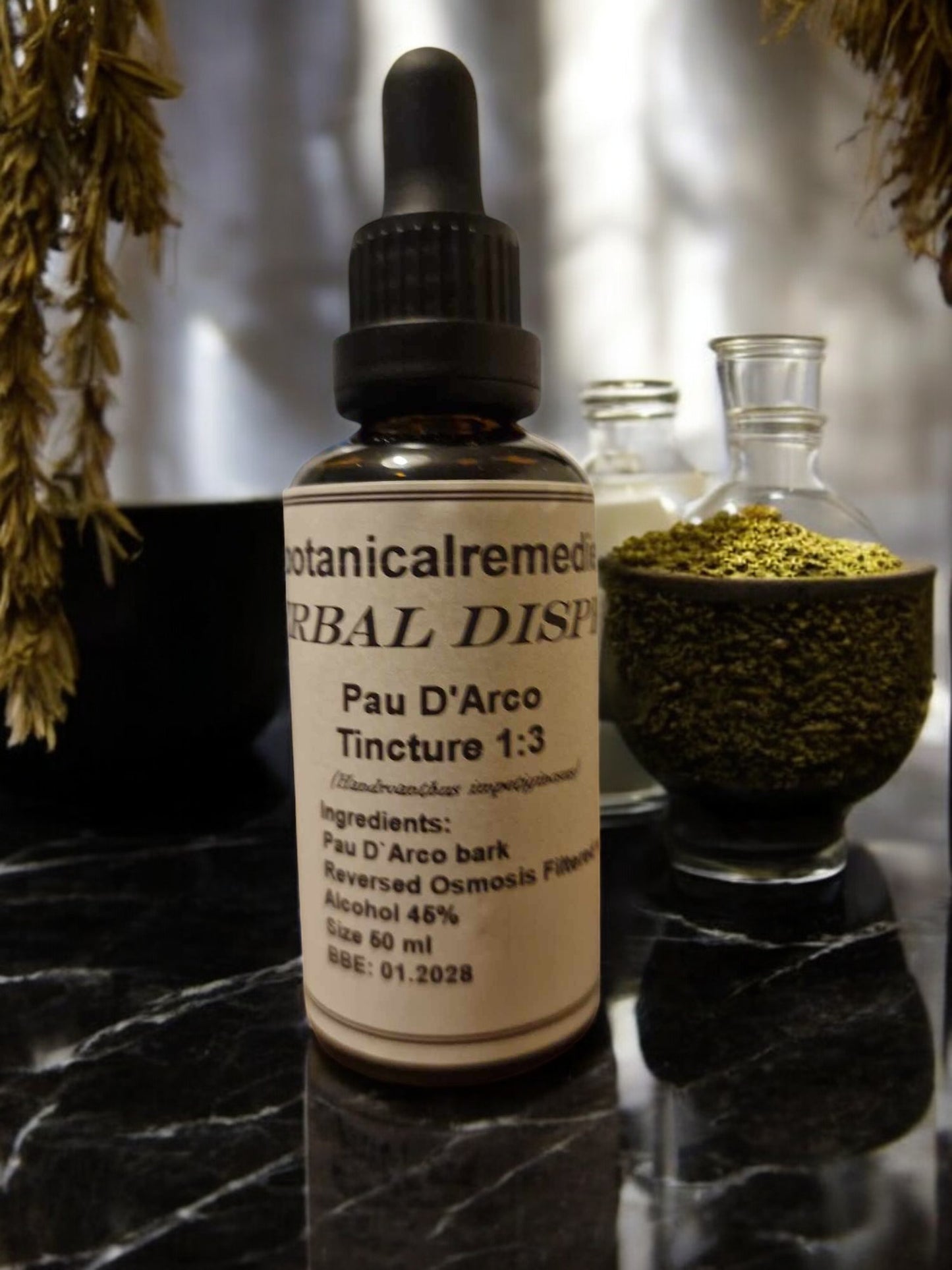 A glass dropper bottle with Pau D'Arco Tincture, an herbal remedy from Botanical Remedies herbal dispensary