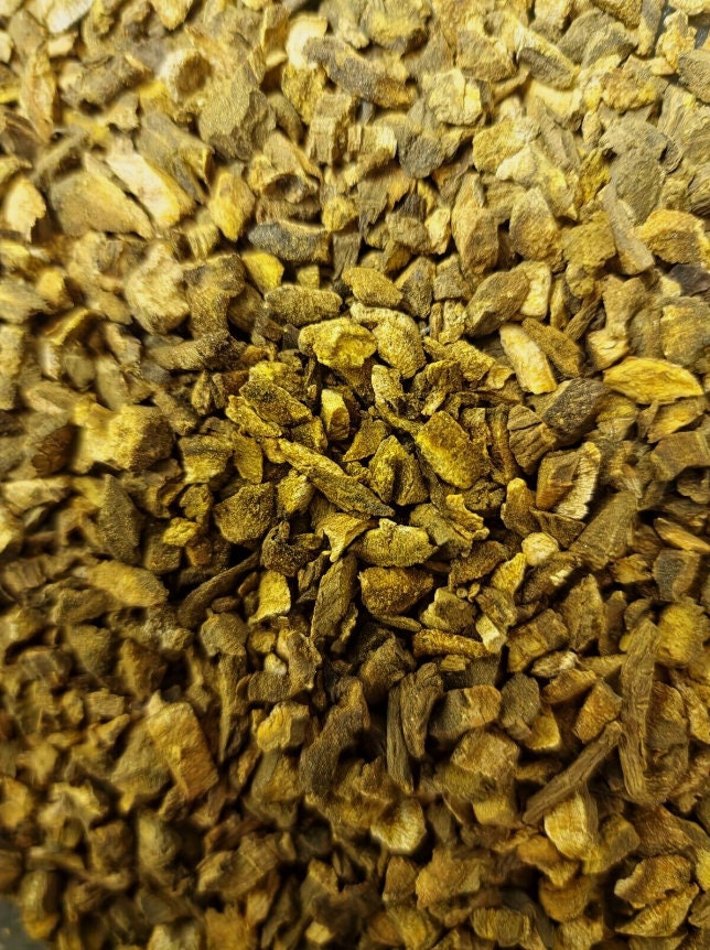 close up of dried and cup Turkey rhubarb root, an loose herbal tea