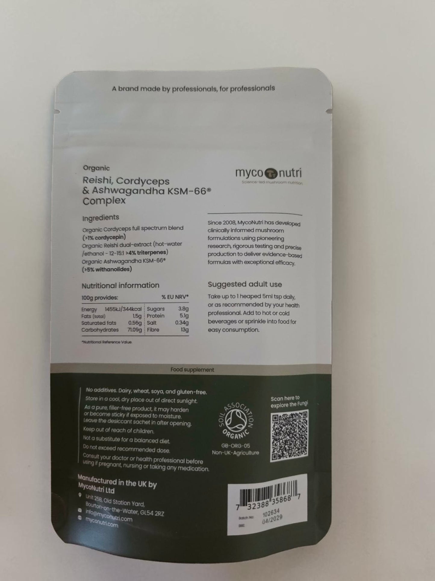 Complete supplement facts and ingredients panel on the back of the MycoNutri Reishi, Cordyceps & Ashwagandha 100g powder pouch. The label guarantees precise clinical yields of >1% cordycepin, >4% triterpenes, and >5% withanolides, while prominently displaying the Soil Association Organic certification and daily dosage instructions