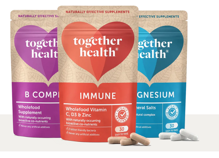 Together Health wholefood supplement pouches featuring B Complex, Immune, and Magnesium alongside natural capsules on a clean white background.