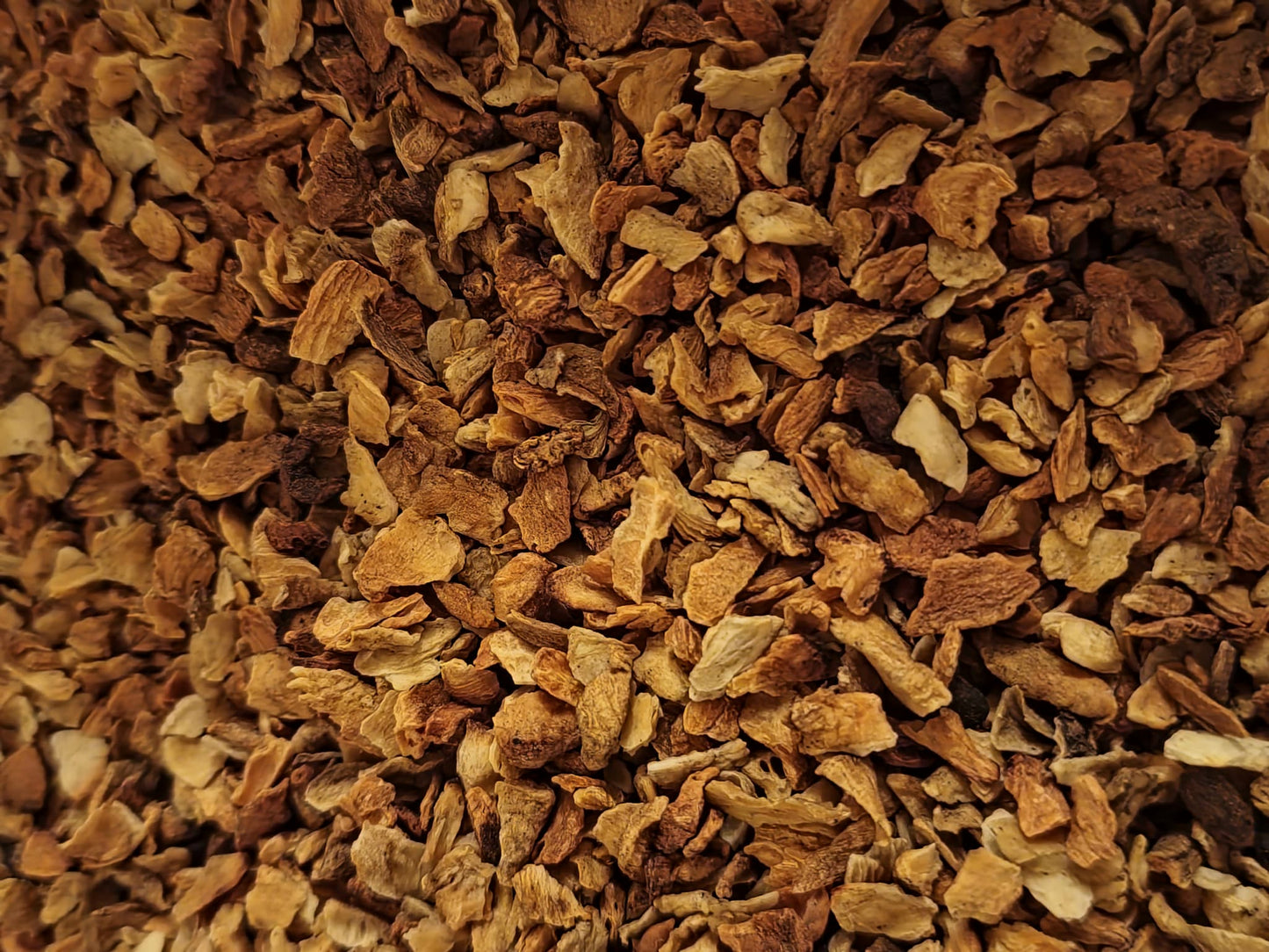Close up of dried and cut Chicory root, an herbal remedy from Botanical remedies herbal dispensary, loose herbal tea