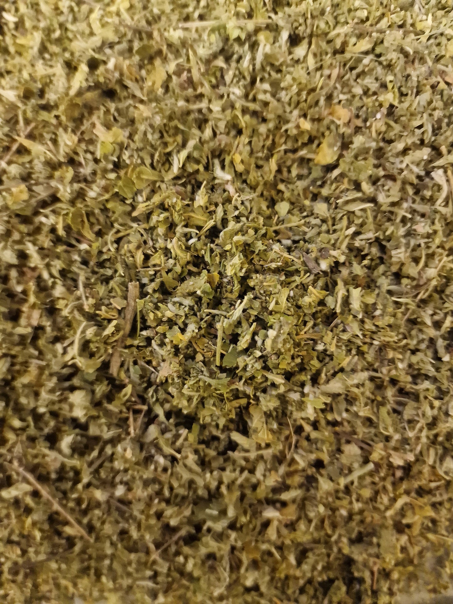 Close up of dried and cut Damiana leaf, an herbal remedy from Botanical Remedies herbal dispensary, loose herbal tea