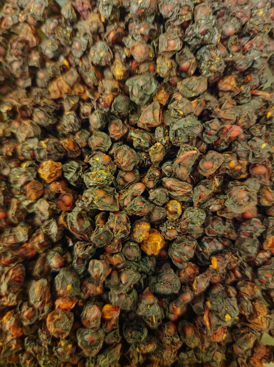 close up of Dried Schisandra berries, an herbal remedy from Botanical Remedies herbal dispensary, loose herbal tea
