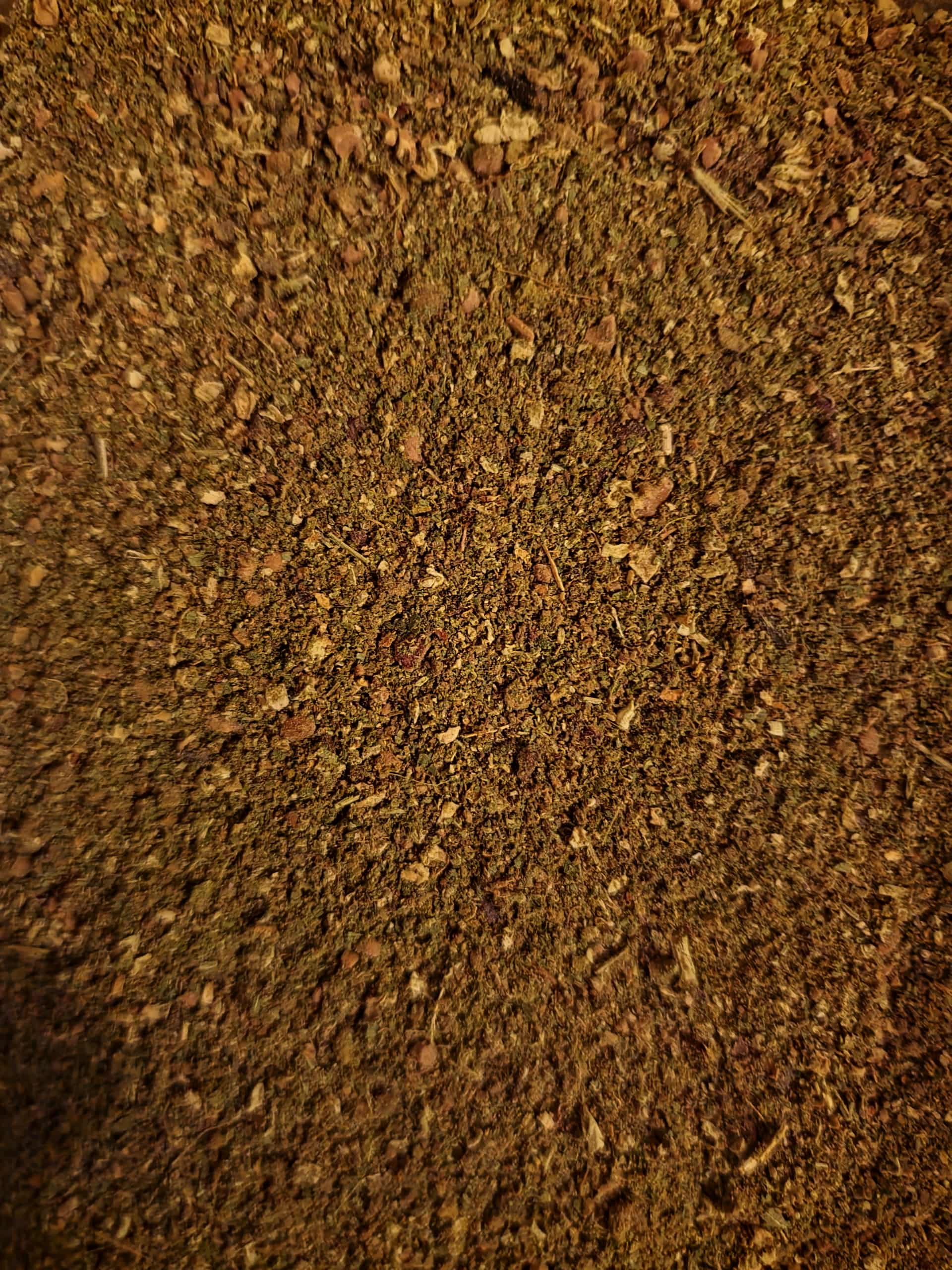 close up of blended and ground full spectrum Hawthorn berry, leaf and flower, an cardiotonic blend, herbal Remedy from Botanical Remedies herbal dispensary