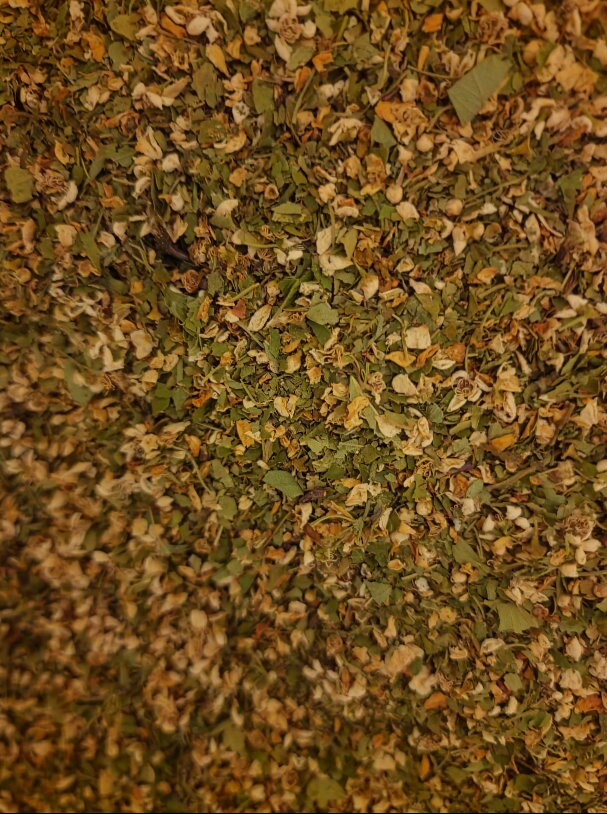 close up of Hawthorn leaf and flower, an herbal remedy from Botanical Remedies herbal dispensary, loose herbal tea, tonic for the heart