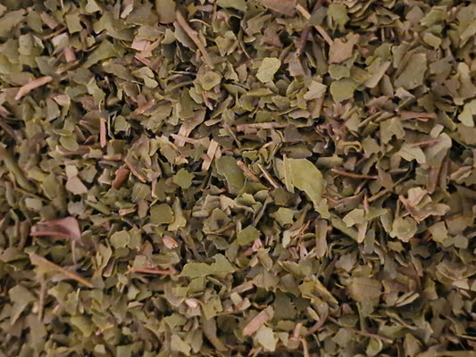 Close-up of dried and cut Lemon myrtle leaves, loose herbal tea