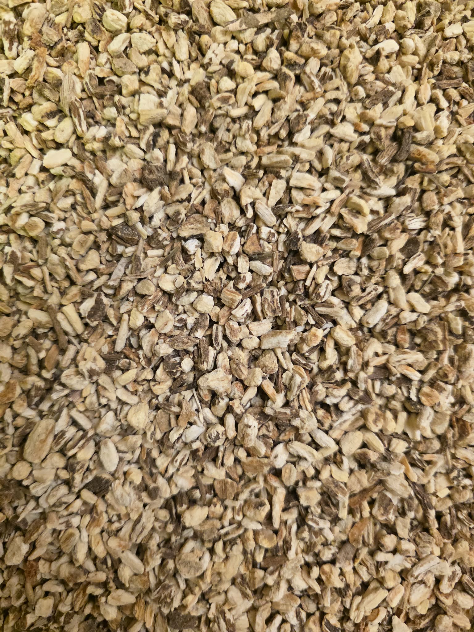 close up of dried and cut Lovage root, an herbal remedy from Botanical Remedies herbal dispensary, loose herbal tea
