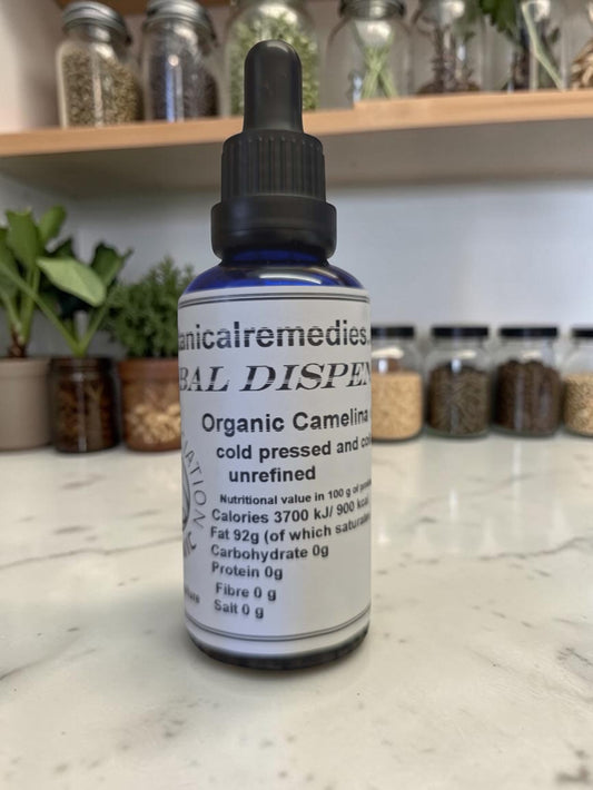 Organic Cold-Pressed Camelina Oil in a 50ml UV-resistant amber glass dropper bottle; multi-use formula for skin, face, hair, and heart health.