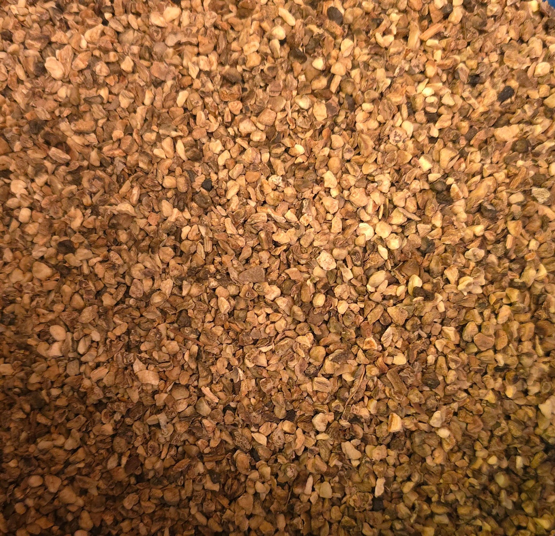 Close-up of dried and cut Organic Devils claw root, an herbal remedy from Botanical Remedies herbal dispensary, loose herbal tea