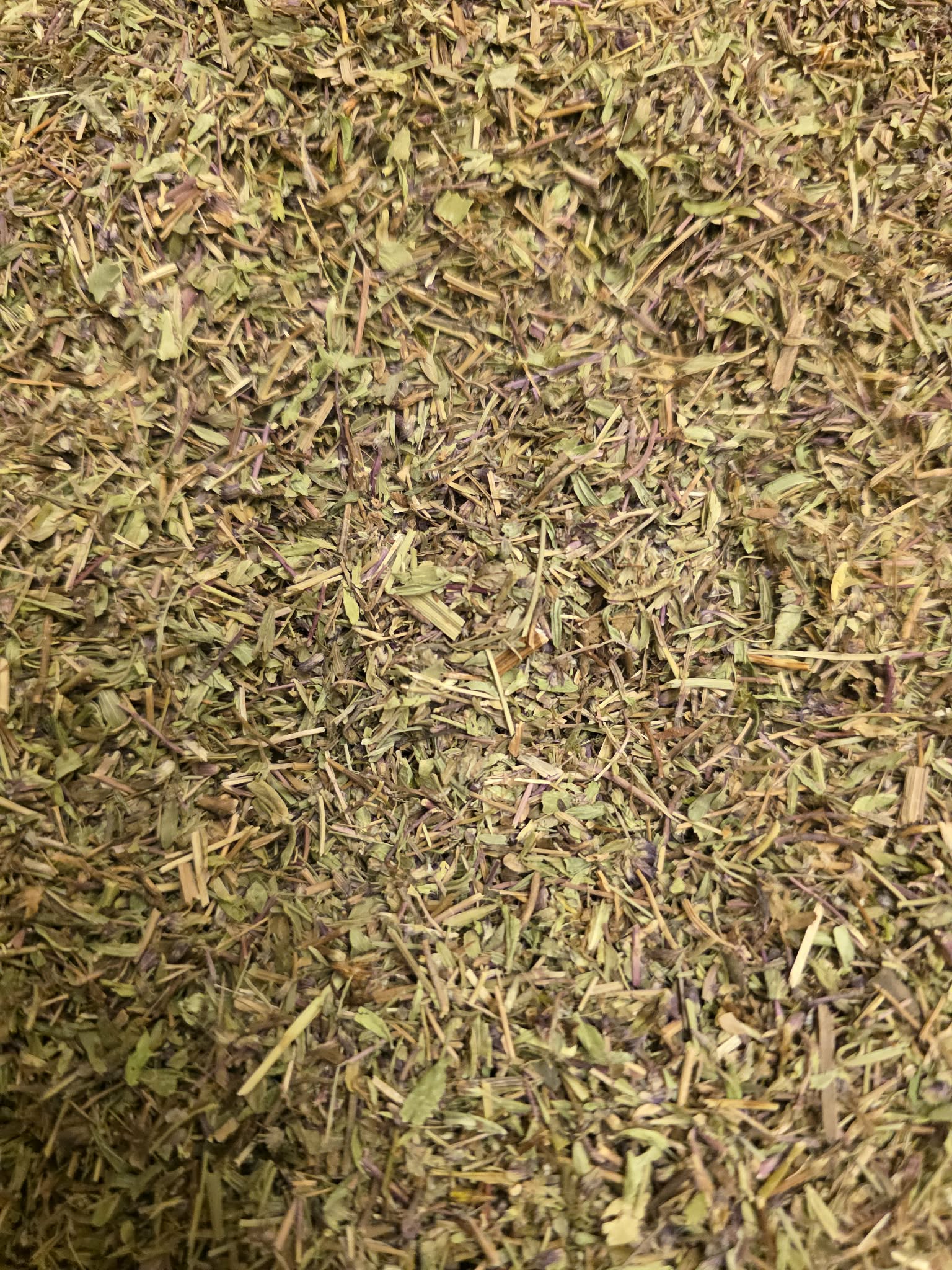 Close-up of dried and cut Organic Wild Thyme herb, an premium herbal remedy from Botanical Remedies herbal dispensary, loose herbal tea