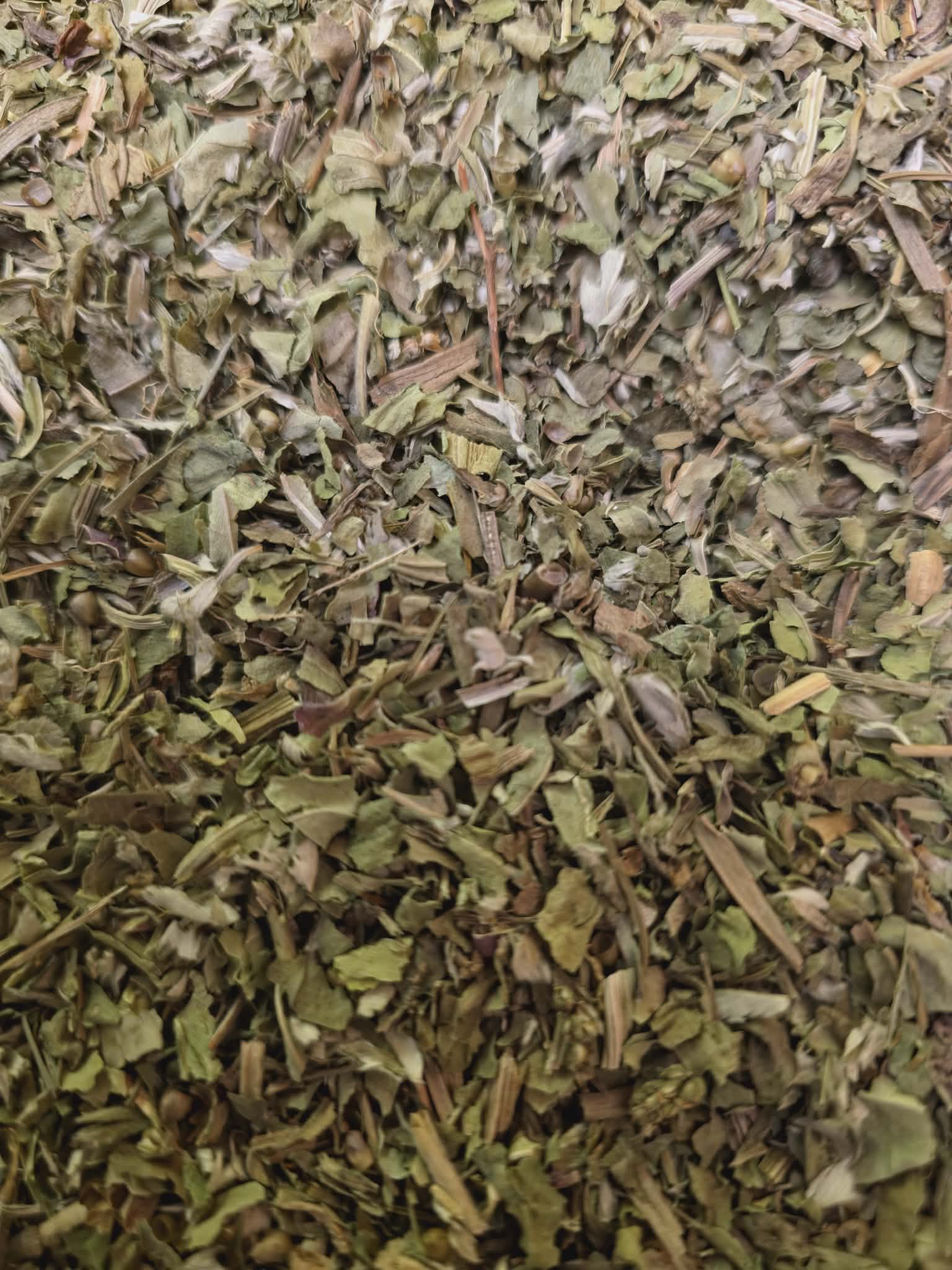 Close-up of dried and cut Organic Greater Plantain leaves, an herbal remedy from Botanical Remedies herbal dispensary, loose herbal tea