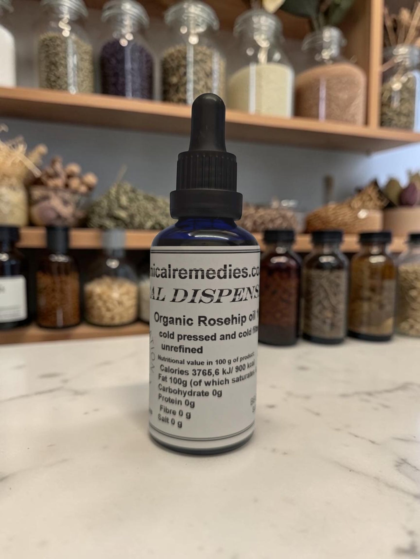 100% Organic Cold-Pressed Rosehip Seed Oil in UV resistant glass dropper bottle, certified food grade and cosmetic grade