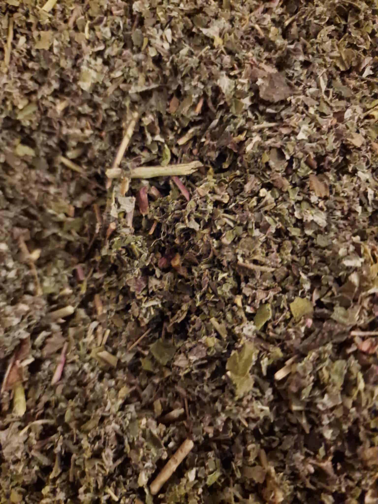 close up of Red Raspberry leaf dried and cut, an herbal tea and herbal remedy for pregnancy from Botanical Remedies herbal dispensary