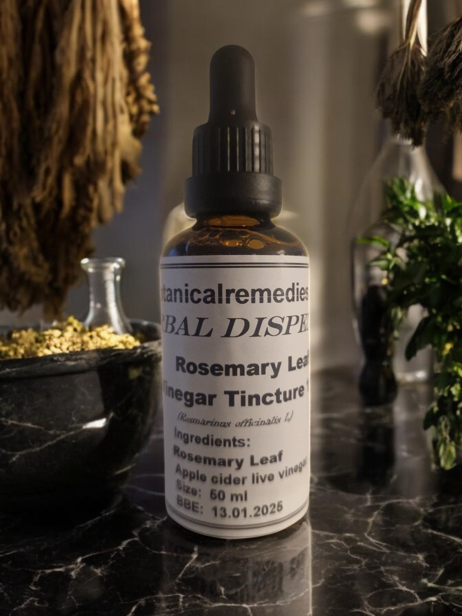 A dropper bottle of Rosemary Leaf vinegar tincture, an herbal remedy from Botanical remedies herbal dispensary