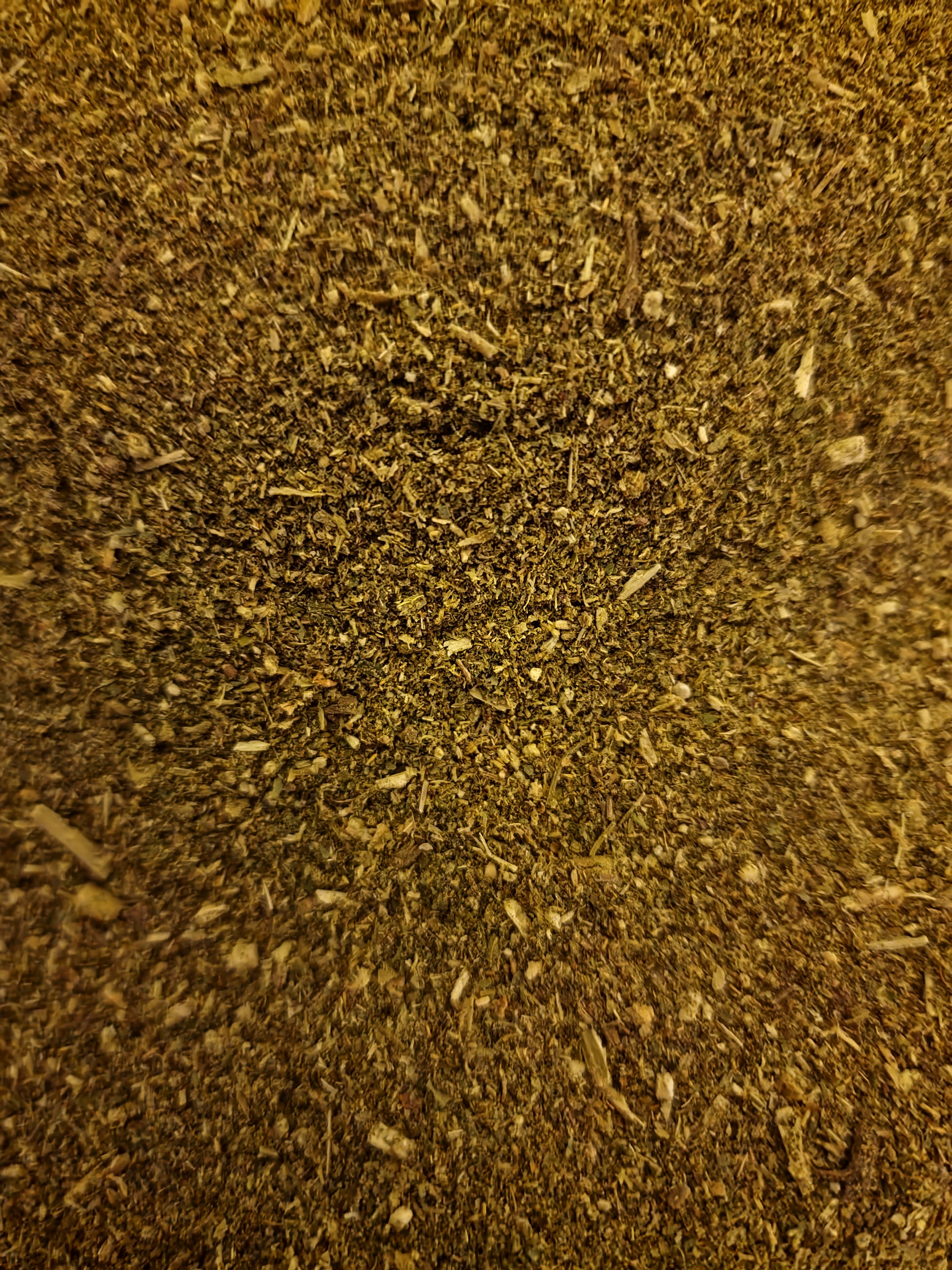 close up of "Sleep well" herbal blend which include Lemon balm leaf, Valerian root, Chamomile flower, Motherwort herb, Hops strobile and Hawthorn flower and leaf, an herbal remedy from Botanical Remedies herbal dispensary