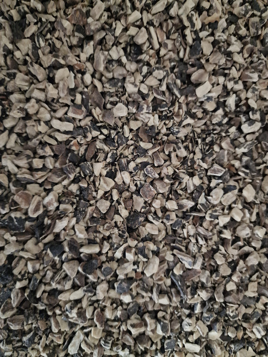 Close up of Dried and cut Comfrey root, an herbal remedy from Botanical remedies herbal dispensary