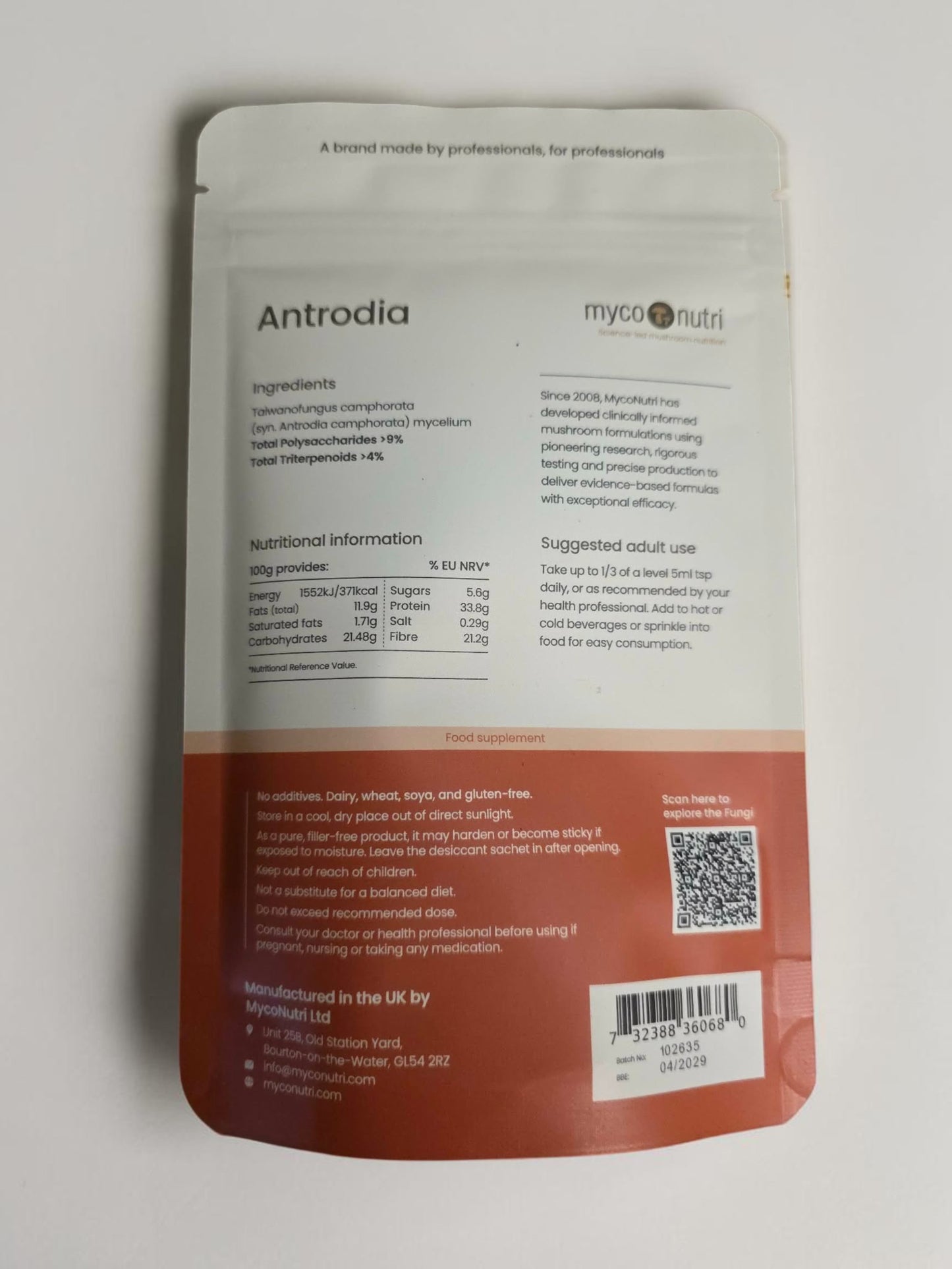 Complete supplement facts and ingredients panel on the back of the MycoNutri Antrodia 100g powder pouch. The label guarantees precise clinical yields of >9% total polysaccharides and >4% total triterpenoids, while displaying the Soil Association Organic and GMP logos for certified purity