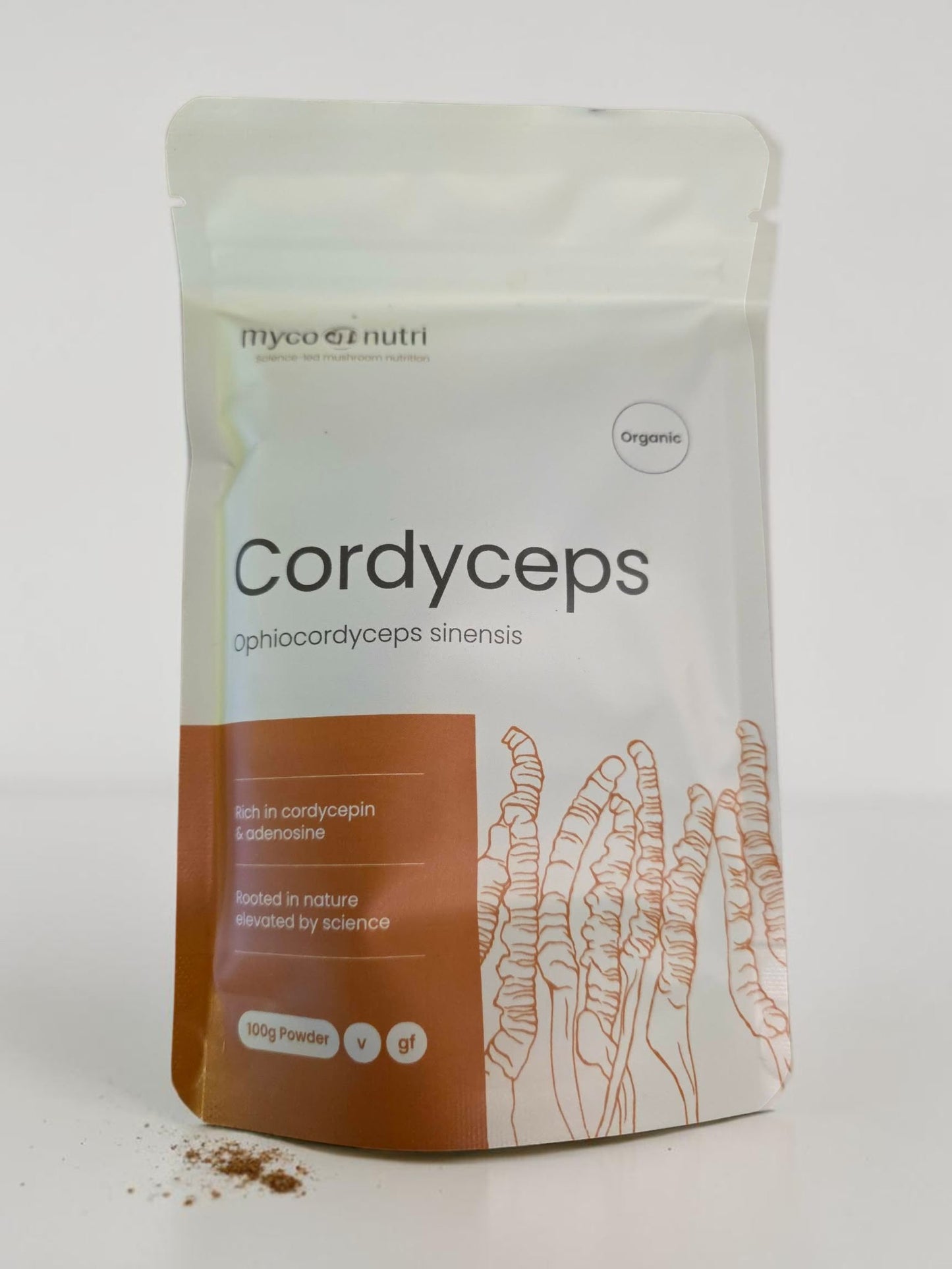 Front view of the clean white and orange stand-up pouch of MycoNutri Organic Cordyceps Powder, 100g. The label highlights that the vegan formulation is rich in cordycepin and adenosine, featuring a botanical illustration of Cordyceps alongside a small dusting of the pure extract powder