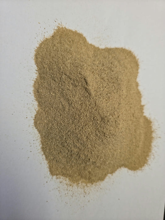 Fine free flowing Soil Association Certified Organic Ashwagandha Root Powder (Withania somnifera), an premium adaptogen milled in the UK by Herb Mark processor on a clean white surface.