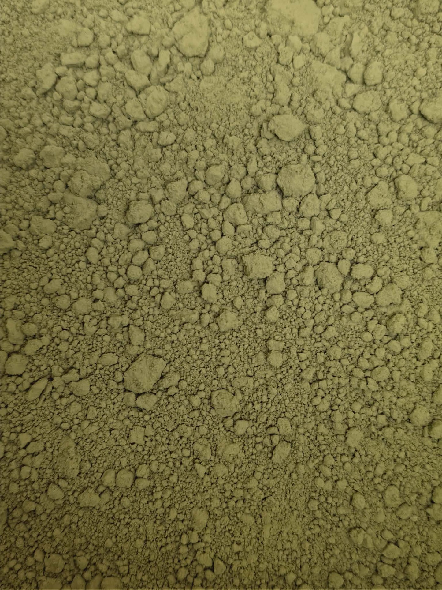 A close-up, highly detailed texture shot of premium Organic Korean Matcha Garucha powder, showing its natural light to mid-green colour and finely milled consistency.