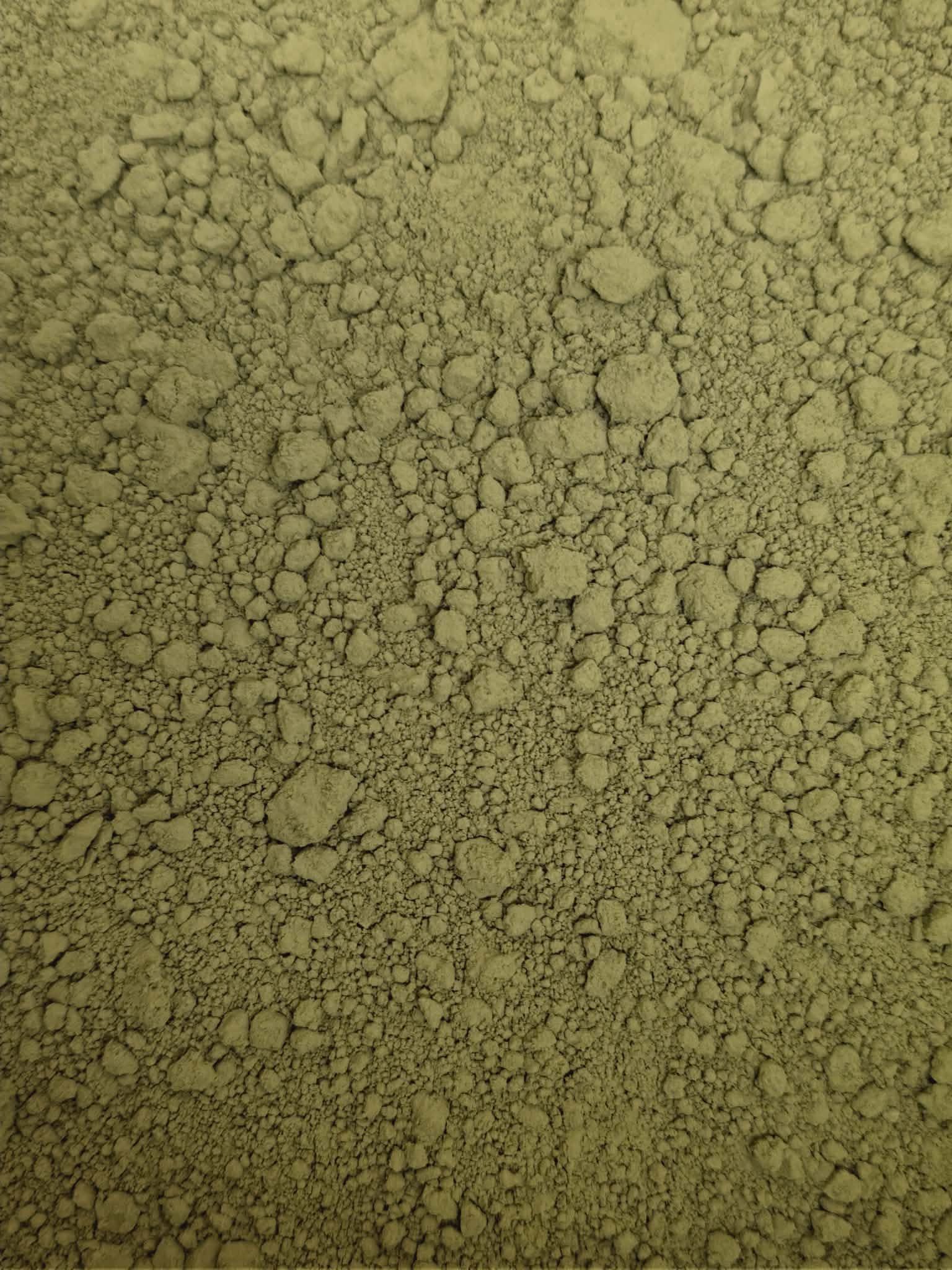 A close-up, highly detailed texture shot of premium Organic Korean Matcha Garucha powder, showing its natural light to mid-green colour and finely milled consistency.
