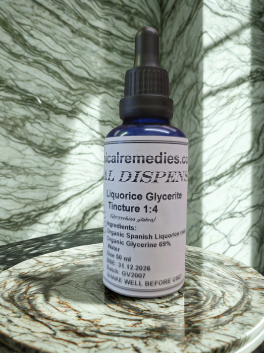 Organic Liquorice Root Glycerite (Glycyrrhiza glabra) by Botanical Remedies. A practitioner-grade 50ml blue glass dropper bottle highlighting its alcohol-free 1:4 ratio and organic Spanish root ingredients, beautifully presented on a naturally lit marble apothecary counter.