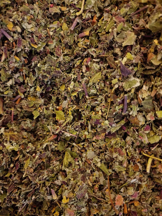 Soil Association Certified Organic Red Raspberry leaf tea (Rubus idaeus) dried and cut showing variegated olive-green fragments and natural purple-tinted leaf veins.