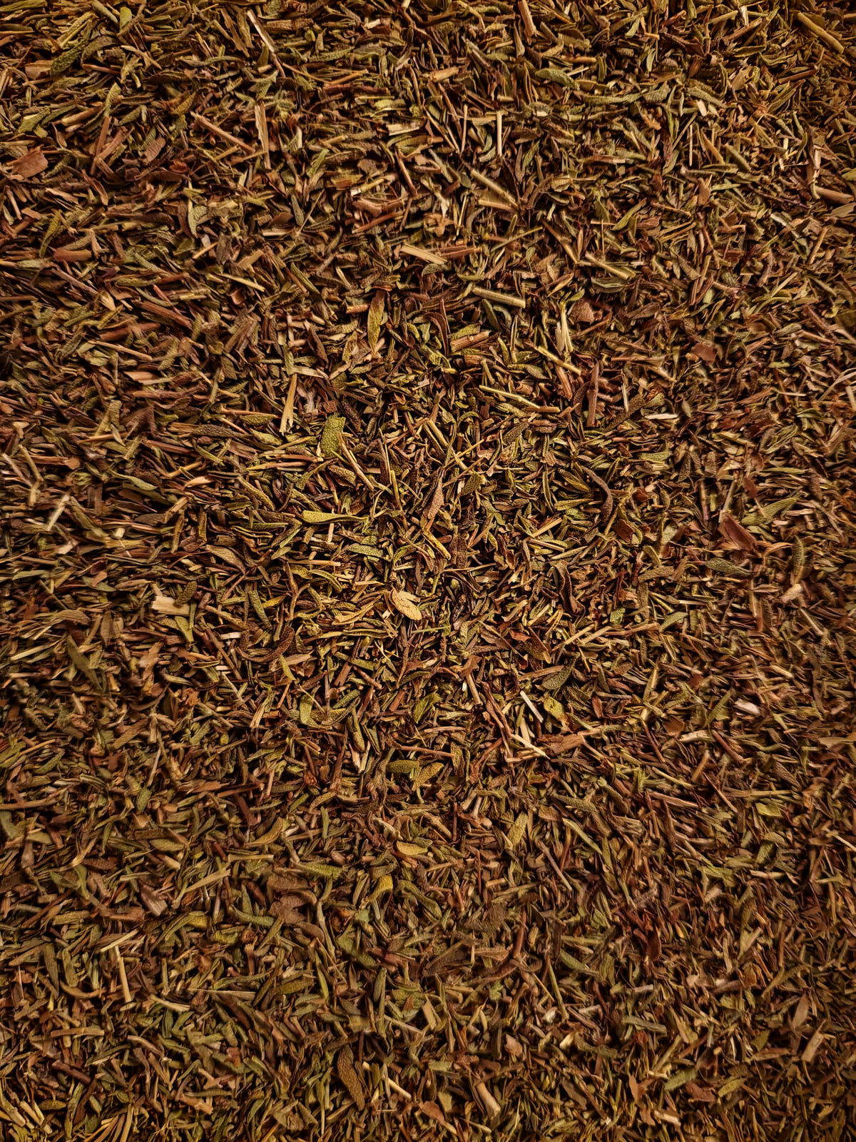 Soil Association Certified Organic dried cut thyme leaf (Thymus vulgaris) from Turkey showing greyish-green pieces for tea and herbalism.