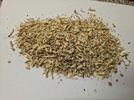 Coarsely cut wild-harvested Hydrangea Root (Hydrangea arborescens) showing pale cream fibrous root pieces for herbal decoctions and apothecary compounding.