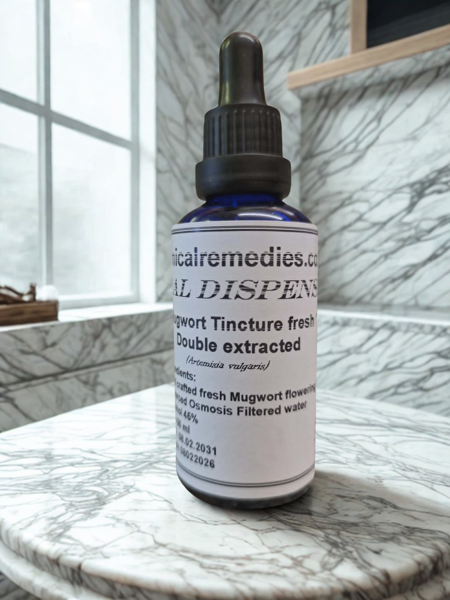 Wildcrafted Fresh Mugwort Tincture (Artemisia vulgaris) by Botanical Remedies. A practitioner-grade 50ml blue glass dropper bottle detailing its advanced double-extraction process, beautifully presented on a bright, natural marble apothecary counter.